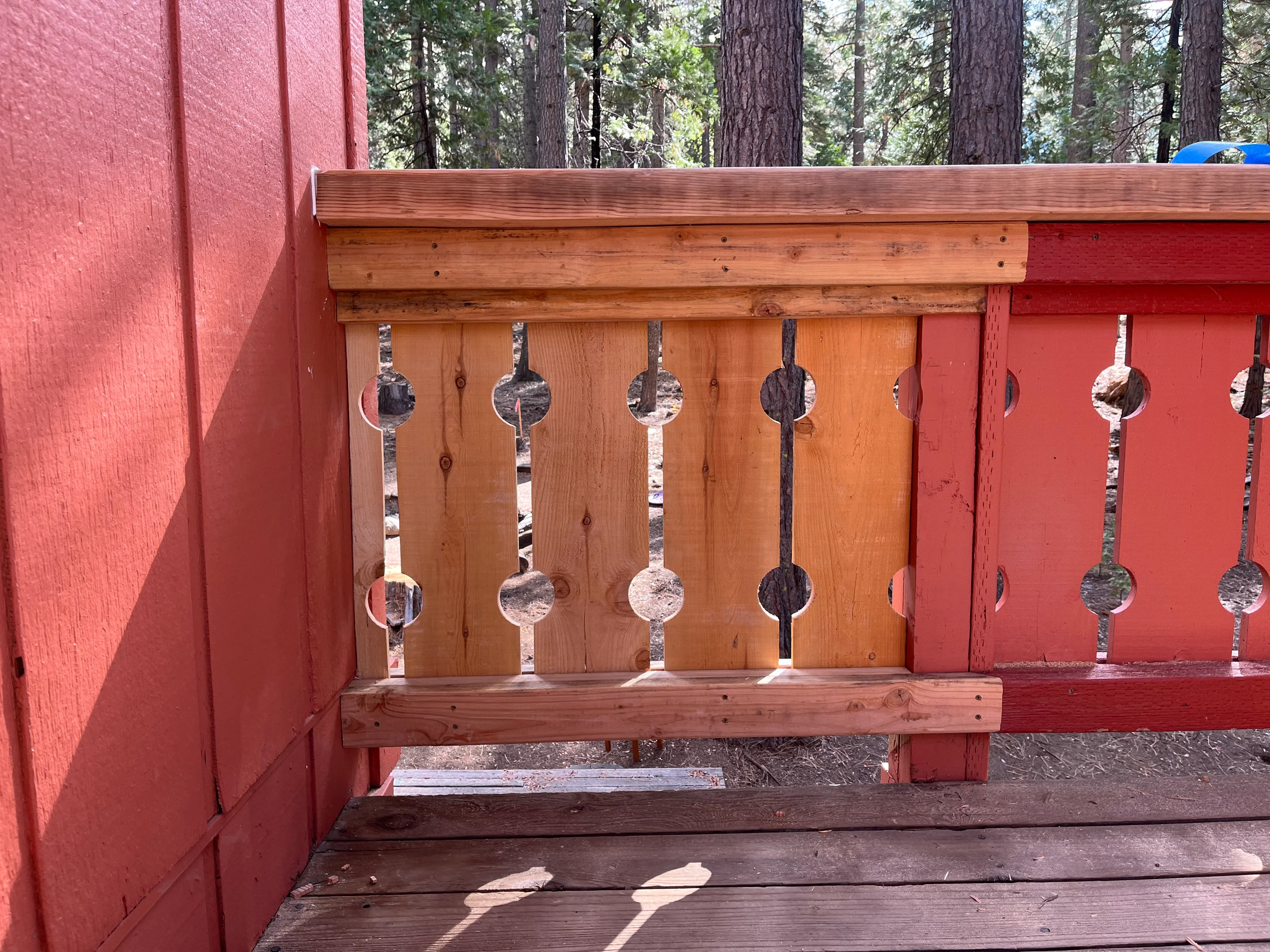 Custom wood railing with turned spindles in natural and dark stain finishes
